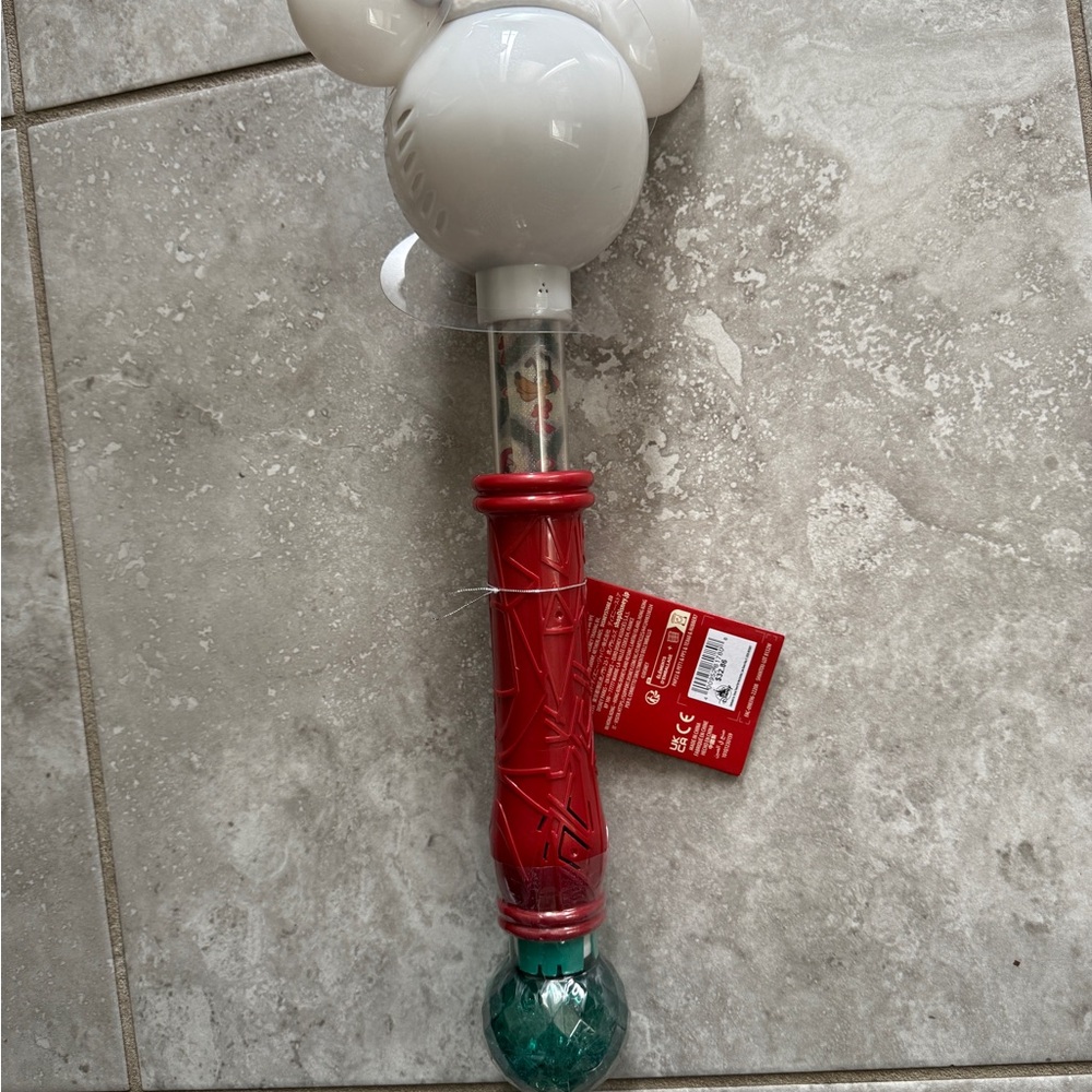 Red and White Toy Wand with Green Accent